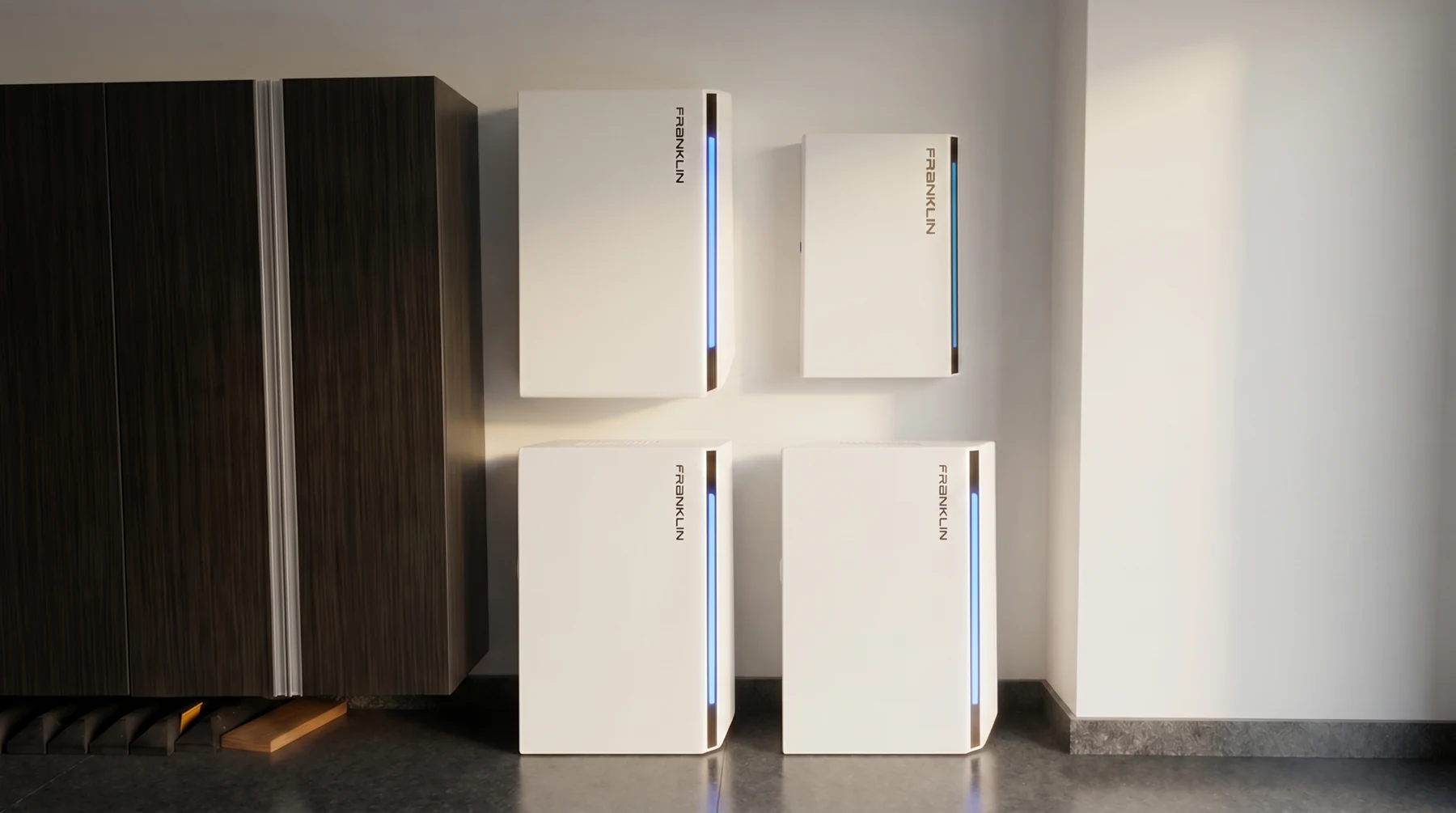 Three FranklinWH aPower 2 batteries and the aGate controller, wall-mounted in a garage